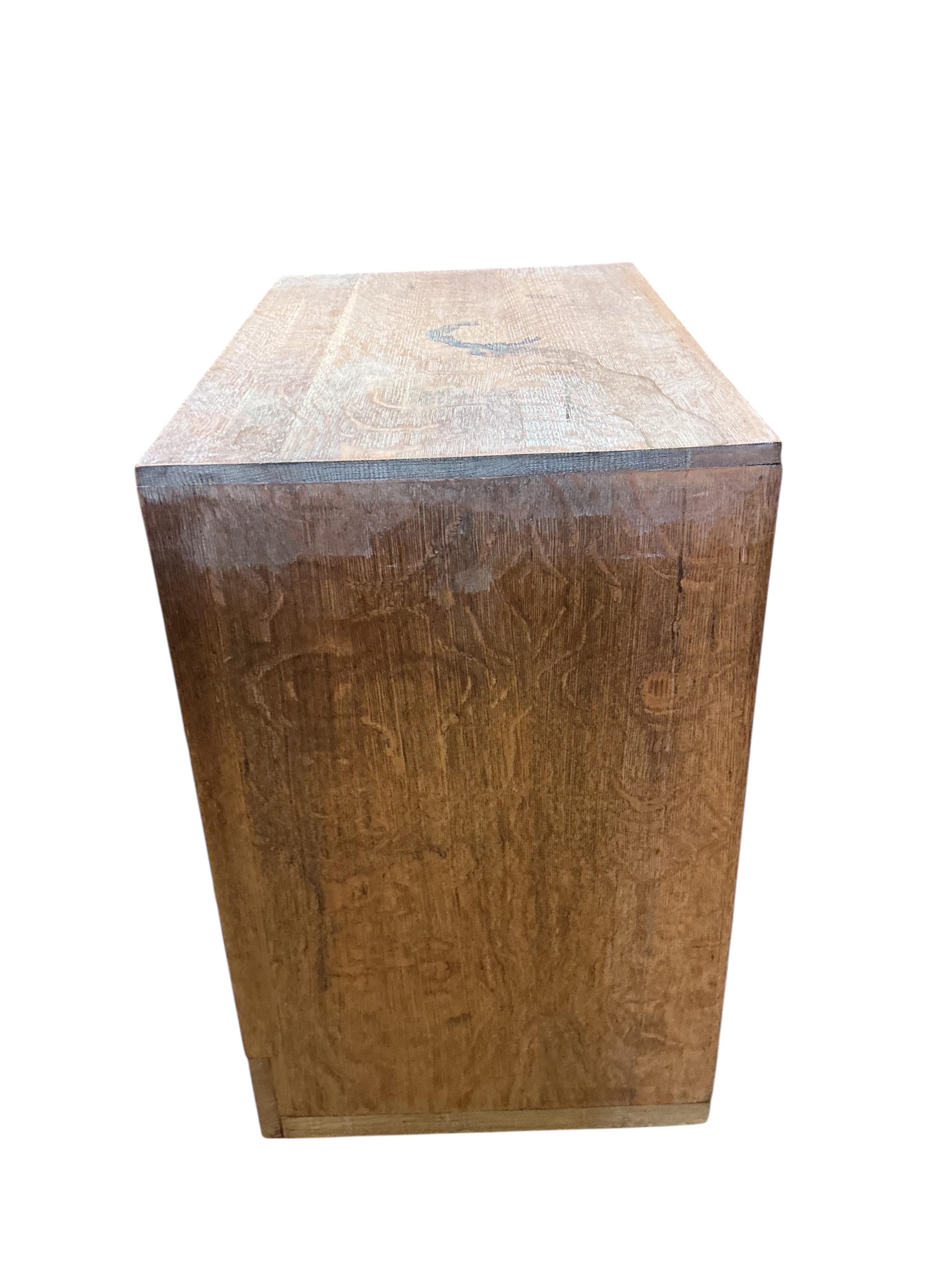 A pair of small limed oak three drawer chests in the manner of Heals, width 68cm, depth 43cm, height 68cm
